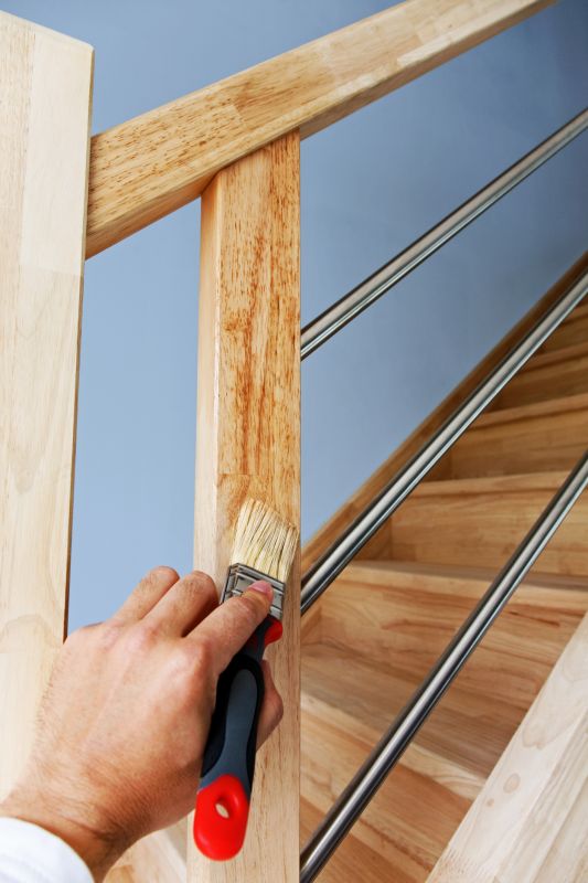 Skilled Painter Applying Finish